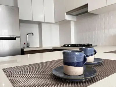 two coffee cups sitting on a counter in a kitchen at Calm and beautiful apartment in San Isidro in Lima
