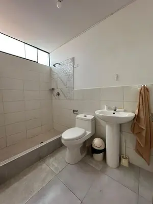 a bathroom with a toilet and a sink at San Bartolo house rental in San Bartolo