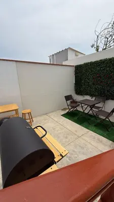a view of a patio with a table and chairs at San Bartolo house rental in San Bartolo