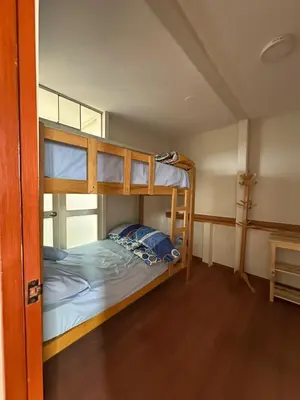 a bunk bed room with two bunk beds in it at San Bartolo house rental in San Bartolo