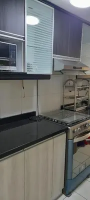 a kitchen with a stove and a counter top at DEPARTAMENTO Central in Lima