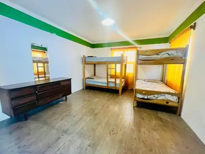 a room with two bunk beds and a dresser at Hostel rivendell lima in Lima