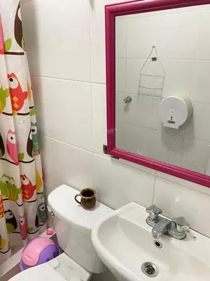 a bathroom with a toilet and a sink and a mirror at Habitación con baño particular, lindas áreas comunes in Lima