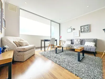 a living room with a couch and a table at Moderno Dpto , Equipado, Céntrico, Vista Increible in Lima