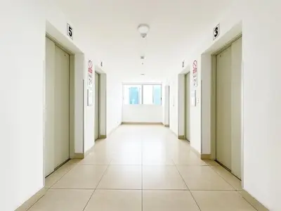 an empty corridor of a building with white walls at Moderno Dpto , Equipado, Céntrico, Vista Increible in Lima