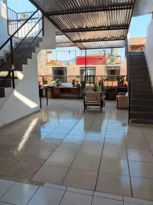 a large lobby with a staircase in a building at Nice stay in Los Olivos in Lima