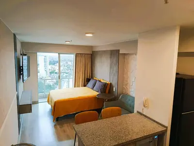 a hotel room with a bed and a window at LA POSADA DE GUILLE - JAVIER PRADO Este 1501 in Lima