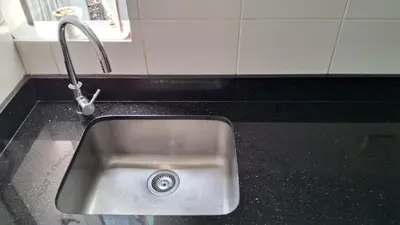 a kitchen sink with a faucet on a counter at El Derby 511 Apart 2 Dorm con Aire Acondicionado in Lima