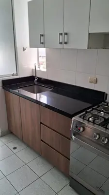 a kitchen with a sink and a stove at El Derby 511 Apart 2 Dorm con Aire Acondicionado in Lima