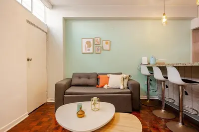 a living room with a couch and a table at Mini depa en el corazón de Miraflores in Lima