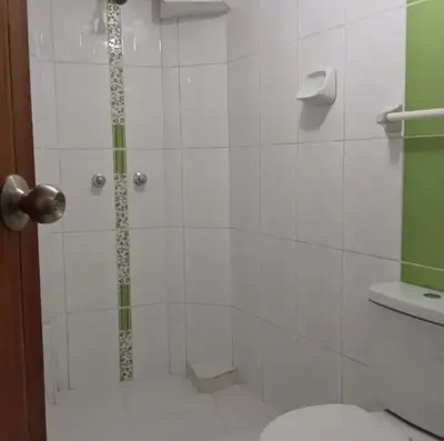 a bathroom with a shower with a toilet at Añay Ayllu in Cusco