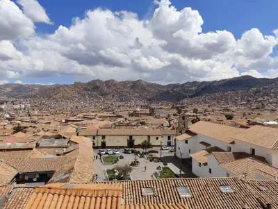 a view of a city with mountains in the background at Añay Ayllu in Cusco