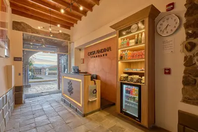 a restaurant with a refrigerator and a clock on the wall at Casa Andina Standard Ayacucho in Ayacucho