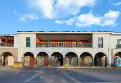 a building with a balcony on top of it at Casa Andina Standard Ayacucho in Ayacucho