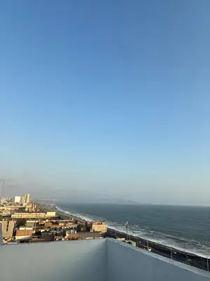a view of the ocean from the roof of a building at Modern and comfortable apartment nearby Aairport in Lima