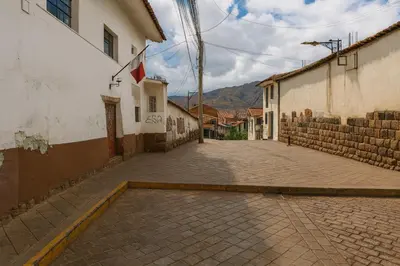 an empty street in a town with buildings at Panay Golden in Cusco