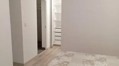 an empty room with white walls and a rug at Se alquila habitación con cama King y baño privado in Lima
