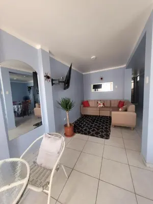 a living room with a couch and a table at AlojamientoMarín in Lima