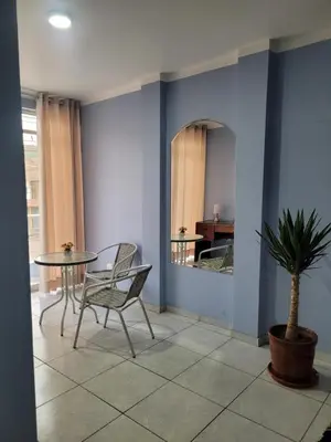 a dining room with a table and a potted plant at AlojamientoMarín in Lima