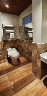 a bathroom with a toilet and a sink at Loft Casa Yucay in Yucay
