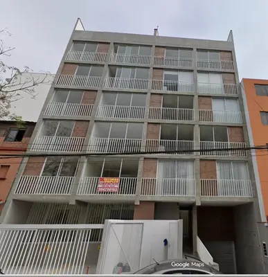 a tall building with balconies on the side of it at Departamento in Magdalena del Mar in Lima