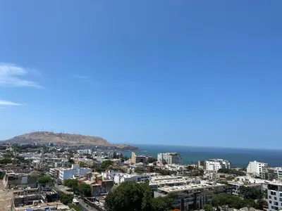 a city with the ocean in the background at Monumental BR1 in Lima