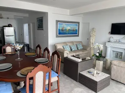 a living room with a table and a couch at Hermosa casa de playa Asia in Lima