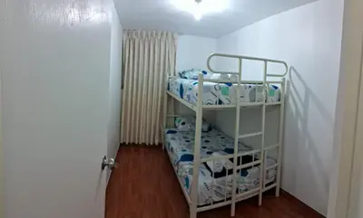 a room with two bunk beds in a room at CasaBlanca2 in Lima