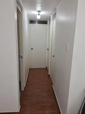 a hallway with white walls and a white door at CasaBlanca2 in Lima