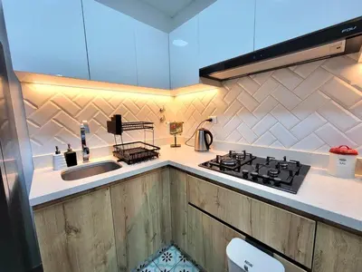 a kitchen with a stove top and a sink at Bello y amplio apartamento, en la mejor zona de Barranco in Lima