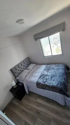 a bedroom with a bed and a window at Departamento con Increíble ubicación en San Miguel in Lima