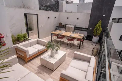 an aerial view of a patio with a table and chairs at Barranco Moderno Style 1BR in Lima