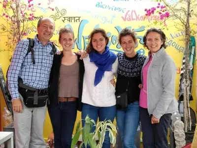 a group of people standing in front of a wall at Atenas Backpacker Hospedaje in Paracas