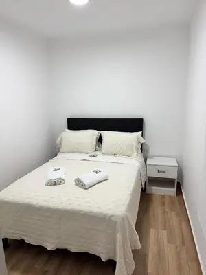a bedroom with a bed with two towels on it at Casa de Playa - Asia - SELENE beach house in Asia