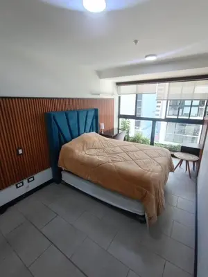 a bedroom with a large bed in a building at Apartment in San Isidro in Lima