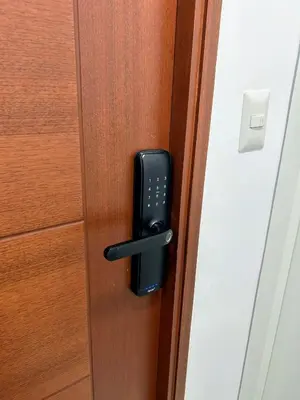 a black door handle on a wooden door at Luxury apartment with panoramic view of San Isidro in Lima