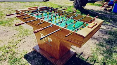 a wooden foosball game in a wooden box at Hotel Rustica Lunahuana in Uchupampa