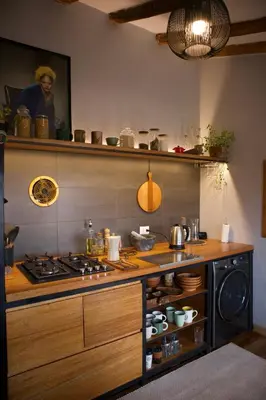 a kitchen with a stove and a counter top at Casa Campestre on the side of Saqsaywaman in Cusco