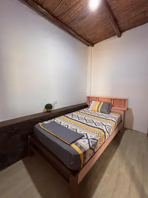 a bedroom with a bed in a room at Casa Puente Azul - Casa de Playa in Cerro Azul
