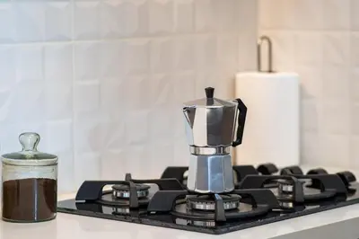a coffee pot sitting on top of a stove at Well-Located and Modern Apartment in Barranco in Lima