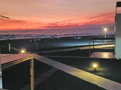 a view of a beach at night with a sunset at Espectacular Casa de Playa en Asia frente al Mar in Asia