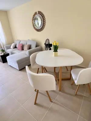 a living room with a table and a couch at Alojamiento Casa en Ica in Ica