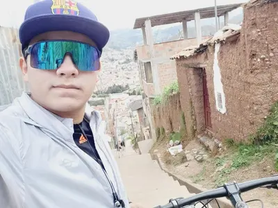 a young man wearing sunglasses and a hat at Casa Conquista in Cusco