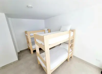 a bunk room with two bunk beds in it at Bujama beach Home Family Asia in Mala