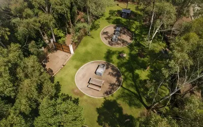 an overhead view of a park with a bench and trees at Bujama beach Home Family Asia in Mala