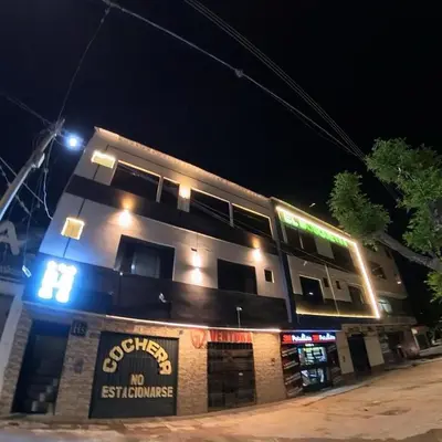 a building with lights on top of it at night at Hostal El Bosque in Huánuco