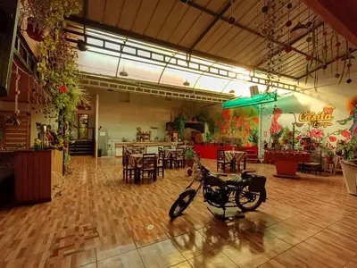 a bike parked in a room with a restaurant at La casa de Goya in Cusco
