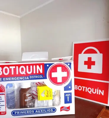 a box of insulin next to a pharmacy sign at La Palmera in Lima
