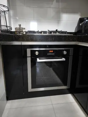 a kitchen with a black oven in a kitchen at Lindo apartmento en PLAZA PRINCIPAL in Lima
