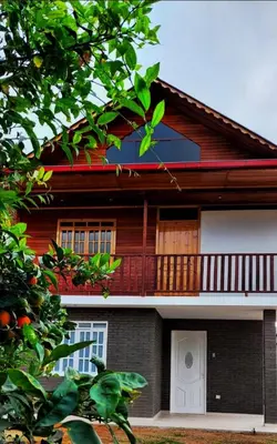 a house with a balcony on the side of it at Edelweisshaus Chontabamba in Oxapampa